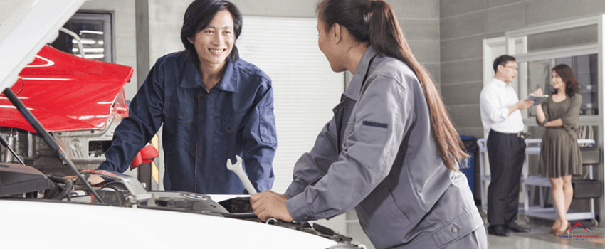 Mechanics and customers in an auto repair shop.