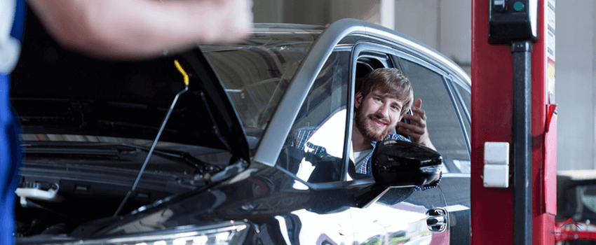 Driver in auto repair shop.