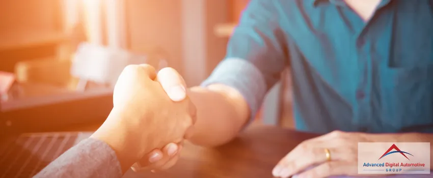 ADAG - Close-up shot of two men shaking hands